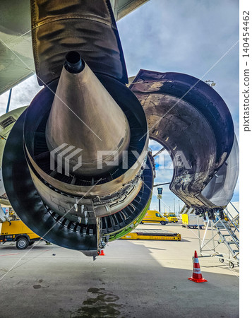 Detailed view of an airplane turbine exhaust and nacelle doors open for service. High-quality industrial photography for aerospace and engineering.. High quality photo Detailed view of an airplane turbine exhaust and nacelle doors open for service. High-quality industrial photography for aerospace and engineering.. High quality photo 140454462