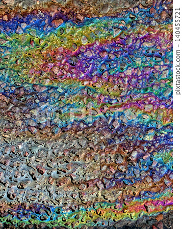 A leaked Car Oil Petrol in The Rain on a Tarmac Road Metallic Rainbow A leaked Car Oil Petrol in The Rain on a Tarmac Road Metallic Rainbow 140455721