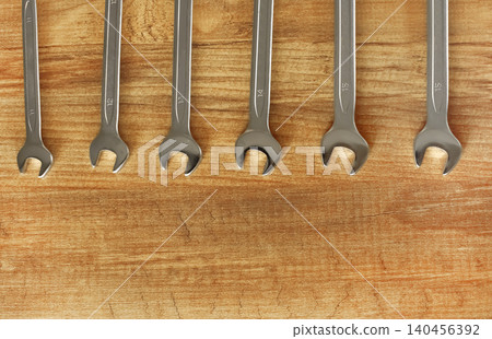 Combination Spanner Wrench Jumbo Chrome Vanadium Steel. Working tools on wooden background. 140456392