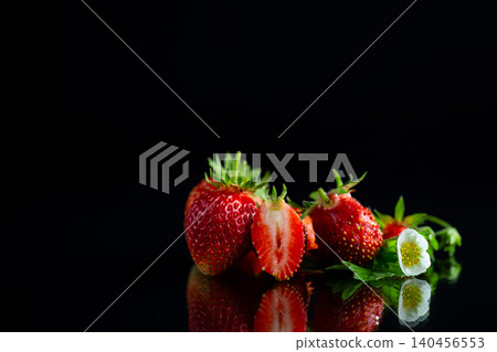 Natural ripe strawberry fruit on elegant black backdrop Natural ripe strawberry fruit on elegant black backdrop 140456553