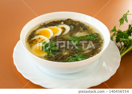 traditional green borscht with sorrel and eggs traditional green borscht with sorrel and eggs 140456554