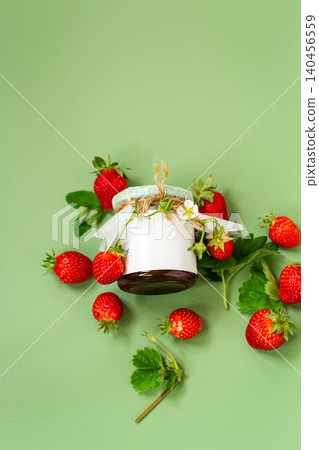Top view of homemade strawberry jam with fresh strawberries and leaves Top view of homemade strawberry jam with fresh strawberries and leaves 140456559