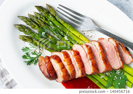 roast duck breast, with asparagus, with red sauce, on a white plate, homemade, no people, roast duck breast, with asparagus, with red sauce, on a white plate, homemade, no people, 140456716