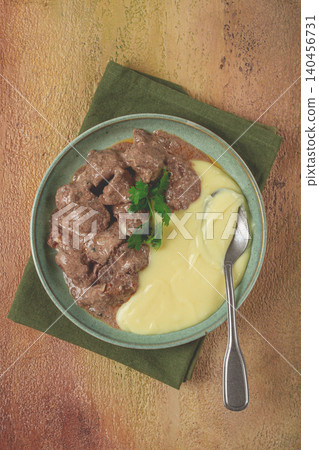liver beef stroganoff with mashed potatoes, table setting in green tones, homemade, liver beef stroganoff with mashed potatoes, table setting in green tones, homemade, 140456731