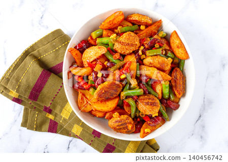steakhouse pfanne, fried potato slices, with meatballs, and vegetable mixture, on a white plate, steakhouse pfanne, fried potato slices, with meatballs, and vegetable mixture, on a white plate, 140456742