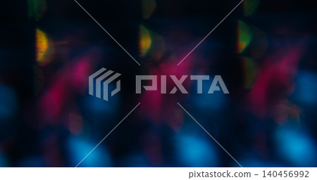 Flare background. Blur lens sparkle. Defocused purple neon blue color glow flicker blaze gleam glimmer shine on abstract bokeh light dark black. Flare background. Blur lens sparkle. Defocused purple neon blue color glow flicker blaze gleam glimmer shine on abstract bokeh light dark black. 140456992