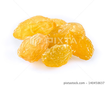 Golden raisins in closeup on white background Golden raisins in closeup on white background 140458637