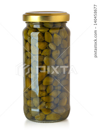 Capers in glass jar on white background Capers in glass jar on white background 140458677