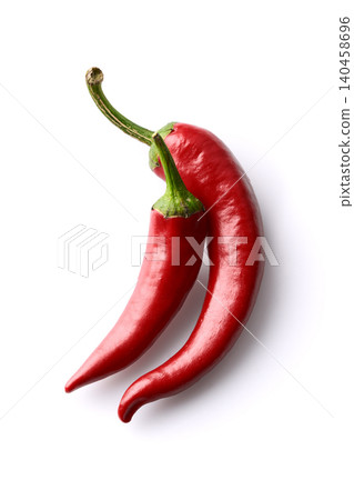 Two red chili peppers on white background Two red chili peppers on white background 140458696
