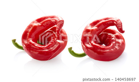 Two red chili peppers on white background Two red chili peppers on white background 140458697