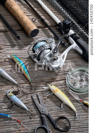 Fishing background angler wobbler and poppers spinning bait concept on wooden background Fishing background angler wobbler and poppers spinning bait concept on wooden background 140458700