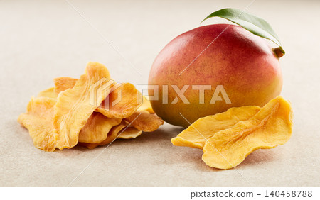 Mango slices dehydrated in closeup Mango slices dehydrated in closeup 140458788