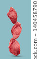 Raw filet mignon on blue background 140458790