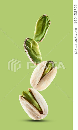 Stack pistachio nuts in closeup on pistachio background Stack pistachio nuts in closeup on pistachio background 140458793