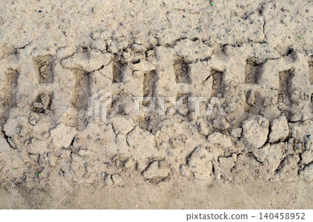 Tire track texture and sand background from heavy machinery wheel, deep tractor or excavator print on dirty soil path Tire track texture and sand background from heavy machinery wheel, deep tractor or excavator print on dirty soil path 140458952