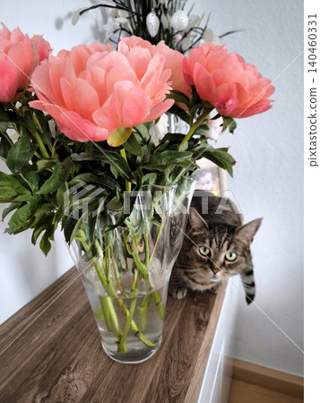 A lush bouquet of coral peonies in a vase and a curious code A lush bouquet of coral peonies in a vase and a curious code 140460331