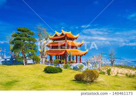 gate at the Vietnamese Buddhist Golden Pagoda Truc Lam Phung Thuy Son on mountain in Nha Trang city in Vietnam. Beautiful panoramic view gate at the Vietnamese Buddhist Golden Pagoda Truc Lam Phung Thuy Son on mountain in Nha Trang city in Vietnam. Beautiful panoramic view 140461173