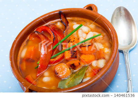Soup of bean with boiled carrots, pepper and greens, served in bowl Soup of bean with boiled carrots, pepper and greens, served in bowl 140461536