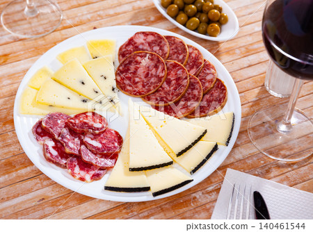 Appetizing sliced smoked sausage and cheese Appetizing sliced smoked sausage and cheese 140461544