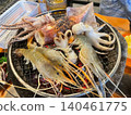 Fresh Mixed Seafood Grilling on Charcoal Grill in Thai BBQ Restaurant 140461775