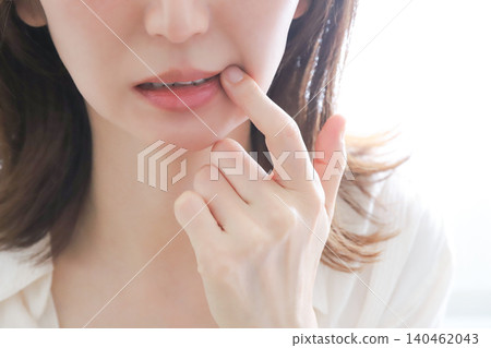 A woman who worries about mouth ulcers A woman who worries about mouth ulcers 140462043