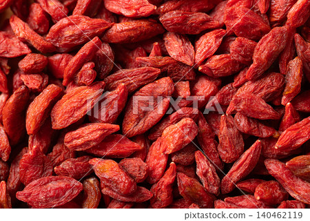 Close-up of organic dried goji berries texture background. Healthy food Close-up of organic dried goji berries texture background. Healthy food 140462119