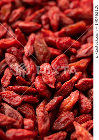Close-up of organic dried goji berries texture background. Healthy food Close-up of organic dried goji berries texture background. Healthy food 140462120