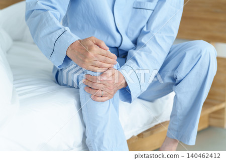 An elderly man suffering from knee pain An elderly man suffering from knee pain 140462412