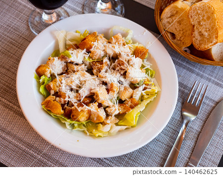 Chicken Caesar salad with tomatoes and cheese Chicken Caesar salad with tomatoes and cheese 140462625