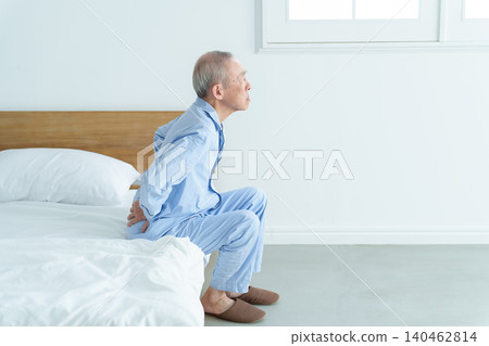 Elderly men suffering from low back pain 140462814