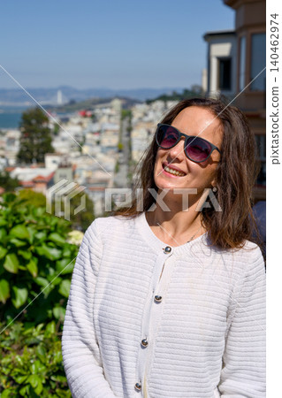 Woman portrait above San Francisco skyline near Lombard Street 140462974
