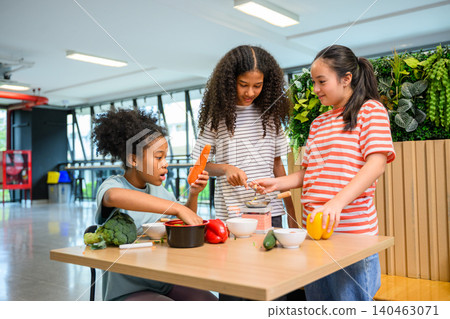 Children learning food education with fresh vegetables cooking class promoting health and nutrition Children learning food education with fresh vegetables cooking class promoting health and nutrition 140463071
