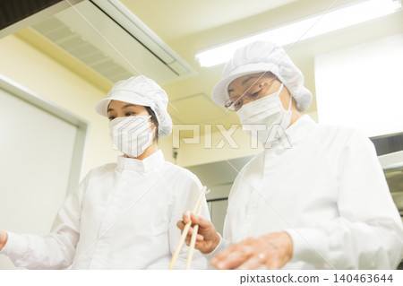 Part-time staff working in white coats Part-time staff working in white coats 140463644