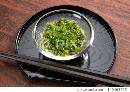 Japanese food wakame seaweed on a black background. 140463735