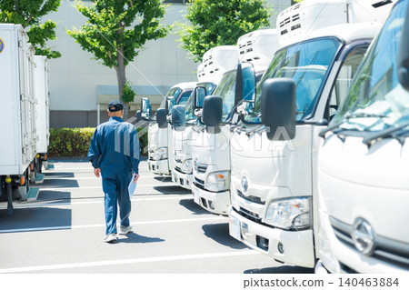 trucks lined up in parking lot trucks lined up in parking lot 140463884