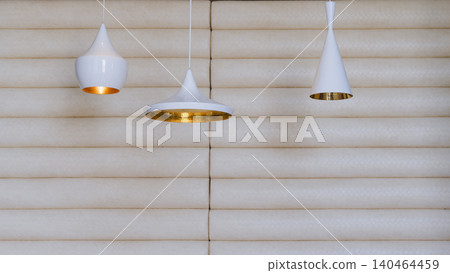 The store interior features rows of white pendant lights. 140464459