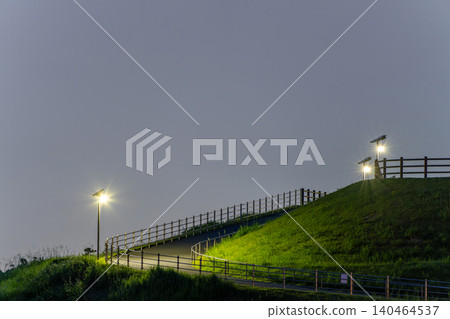 Nighttime slope and streetlights Nighttime slope and streetlights 140464537