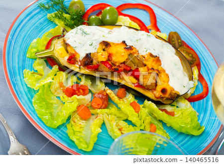 Stuffed tasty eggplant baked with vegetables and cheese Stuffed tasty eggplant baked with vegetables and cheese 140465516
