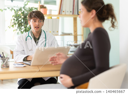 Woman in the third trimester listens to the doctors recommendations Woman in the third trimester listens to the doctors recommendations 140465667