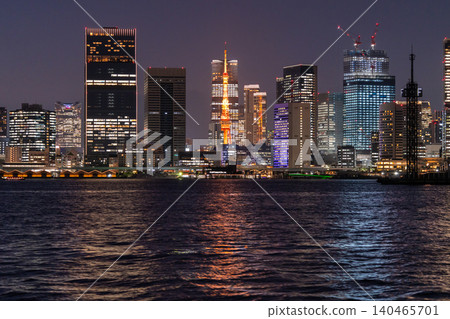 A night view of Tokyo Tower and skyscrapers across Tokyo Bay. A night view of Tokyo Tower and skyscrapers across Tokyo Bay. 140465701