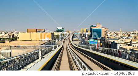 Elevated view of the Riyadh Metro rail system and urban development along King Abdullah Road in Riyadh, Saudi Arabia. Elevated view of the Riyadh Metro rail system and urban development along King Abdullah Road in Riyadh, Saudi Arabia. 140465868