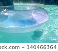 Sparkling water surface and clear inflatable ring 140466364