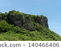 Clear skies and cliffs covered in greenery 140466406