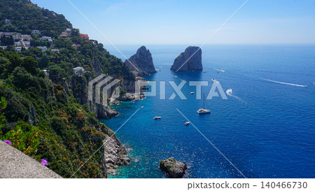 Beautiful coastline - Faraglioni rocks at Capri In Naples, Italy. Beach landscape. Beautiful coastline - Faraglioni rocks at Capri In Naples, Italy. Beach landscape. 140466730