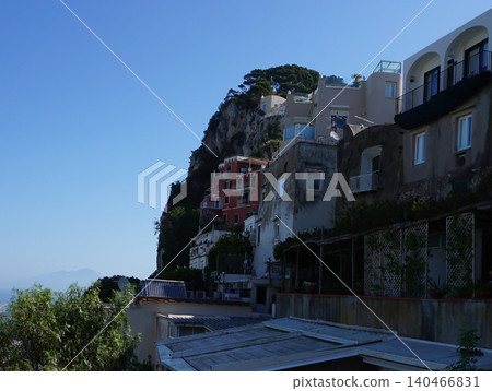 Coastal slopes of the island Capri with luxurious villas located on them. Coastal slopes of the island Capri with luxurious villas located on them. 140466831