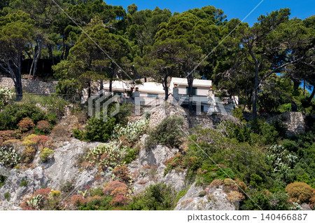 Coastal slopes of the island Capri with luxurious villas located on them. Coastal slopes of the island Capri with luxurious villas located on them. 140466887
