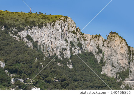 Coastal slopes of the island Capri with luxurious villas located on them. Coastal slopes of the island Capri with luxurious villas located on them. 140466895