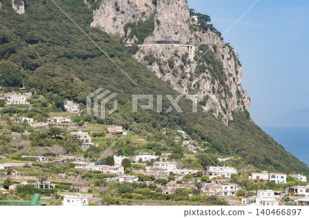 Coastal slopes of the island Capri with luxurious villas located on them. Coastal slopes of the island Capri with luxurious villas located on them. 140466897