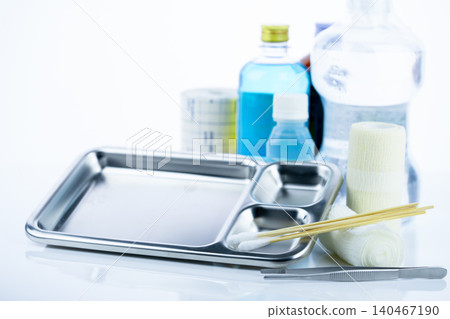 Medical equipment for treating infections. Wound care dressing set. Medical supplies for nurses. Conform bandage, forceps, cotton stick, alcohol. Sterile dressing materials. Healthcare equipment. 140467190