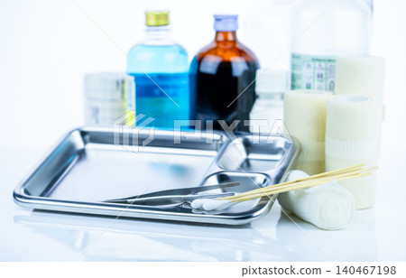 Medical equipment for treating infections. Wound care dressing set. Medical supplies for nurses. Conform bandage, forceps, cotton stick, alcohol. Sterile dressing materials. Healthcare equipment. 140467198